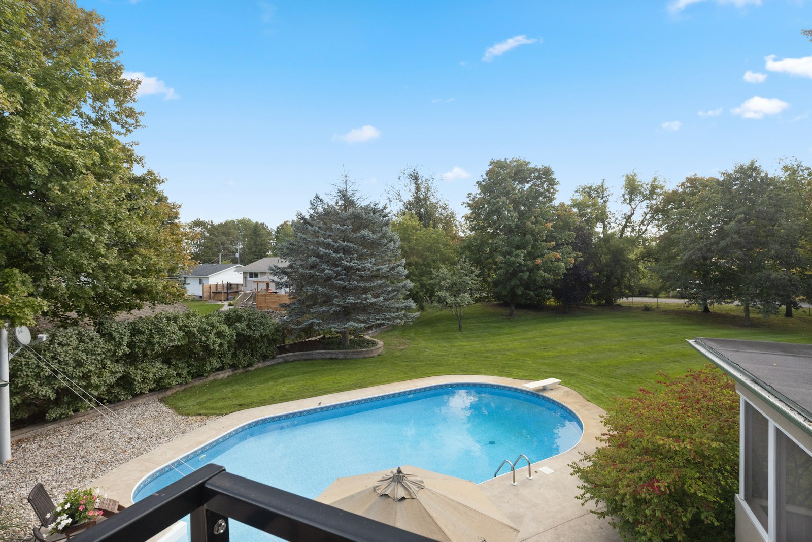 Custom backyard pool built by Enoch Pool Builders
